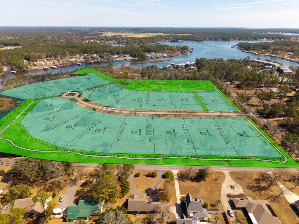 land, water, aerial view of wooded waterfront property and homesites along Wolf Creek in South Alabama